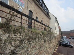 Roman wall alongside a modern car park.